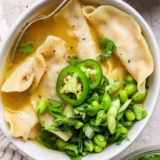 Wonton Soup Topped with Edamame Herb Salad